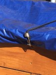 Eyelet screw with secured tarp